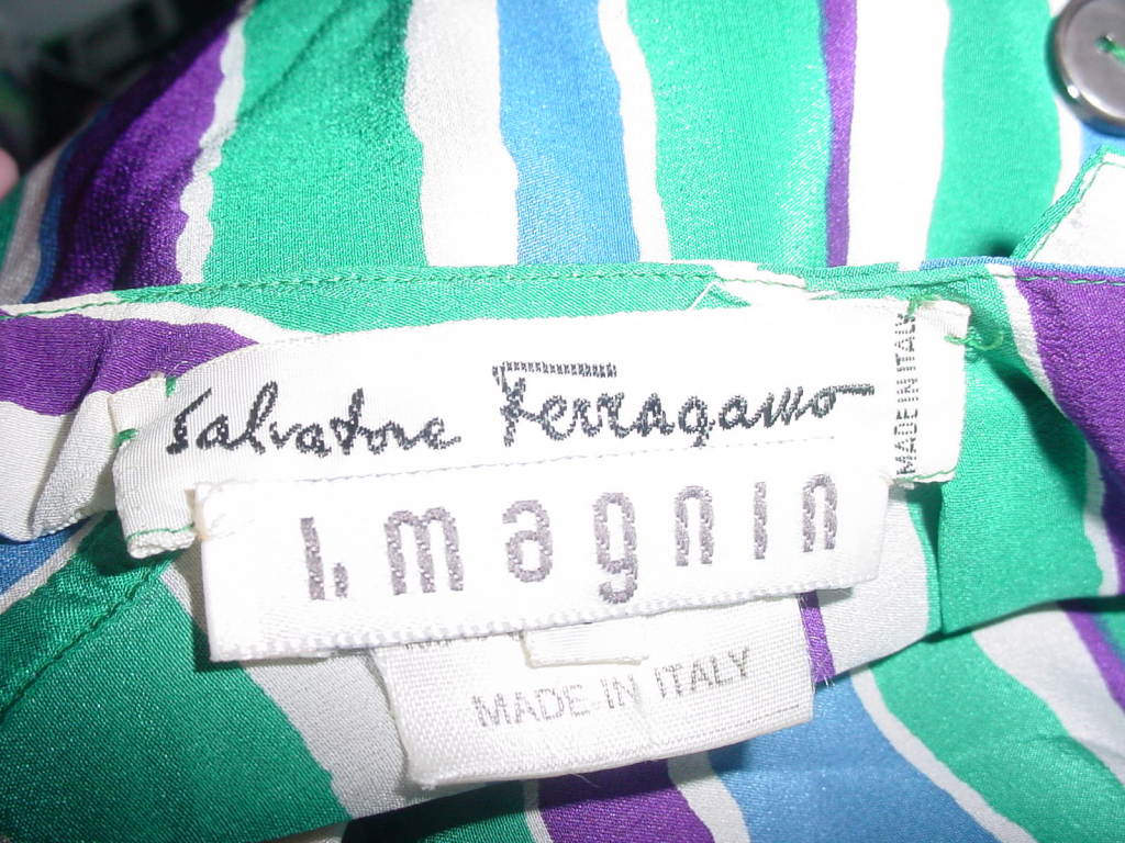 Vintage silk blouse by Salvatore Ferragamo. Buttons in back. Size 4.  Fits up to a 35 inch bust, 20 in. long. White, green, purple and blue stripes.