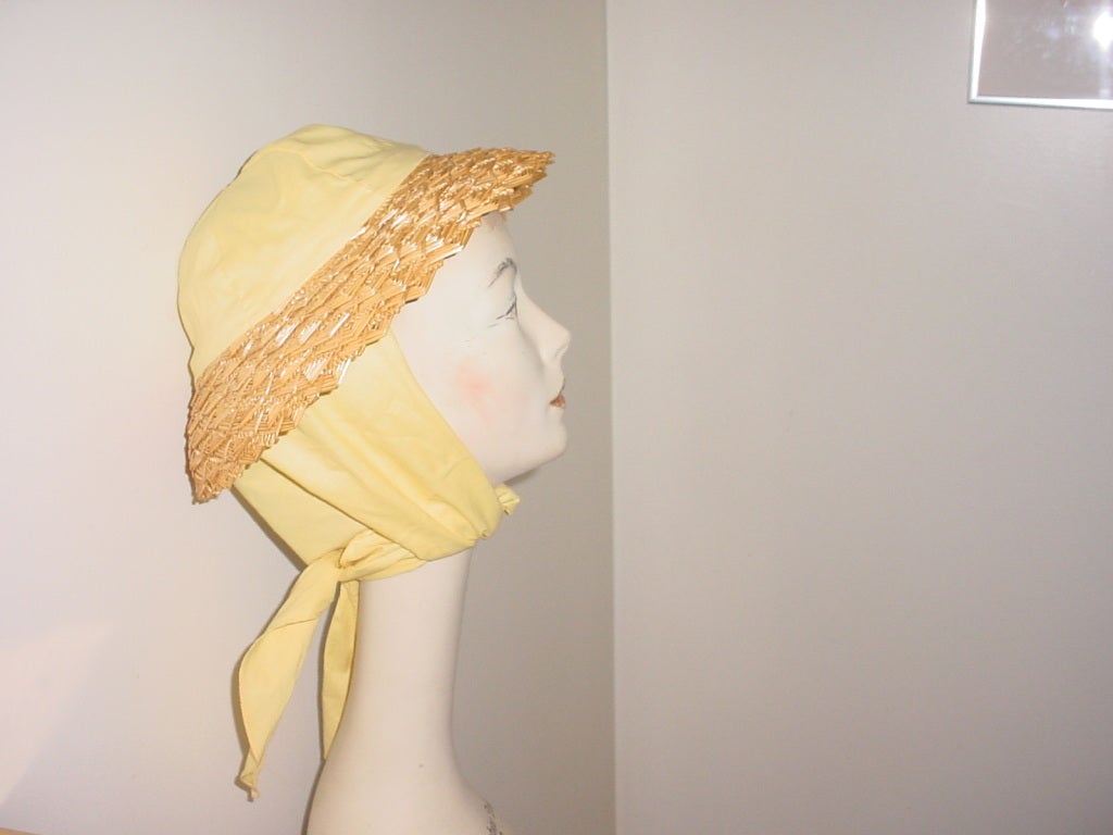 Vintage straw hat with yellow cotton blend scarf. Excellent condition.
