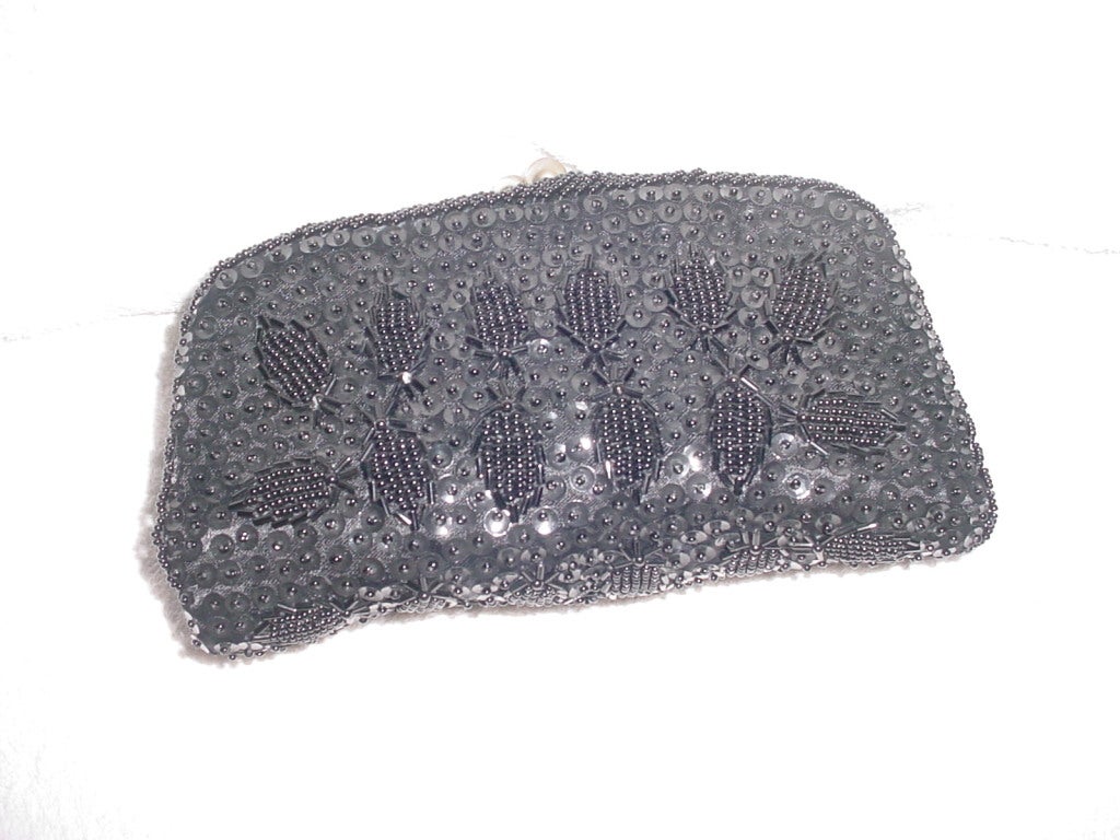 Vintage 60s black sequin and beaded foldover clutch. Unworn, excellent condition.  8 x 8.5 inches. Kiss lock