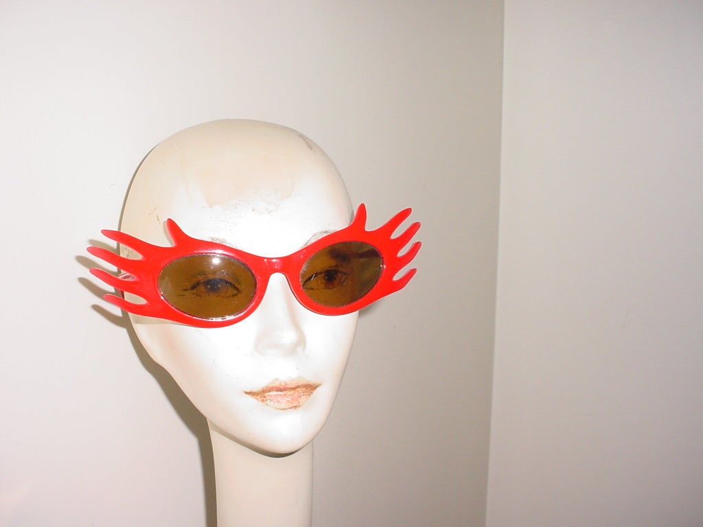 Vintage 1980s red plastic fingers sunglasses.