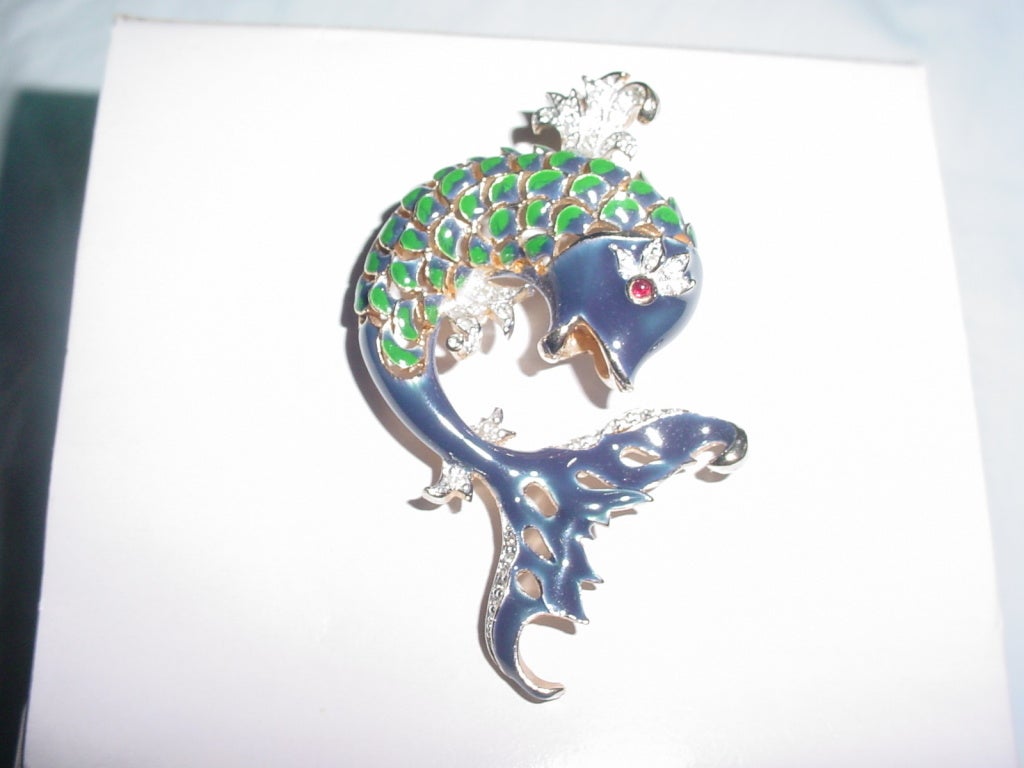 Vintage enamel fish brooch signed Panetta. Navy and green enamel with rhinestones. Cabochon eye. Can also be worn as a pendant. Excellent unworn condition. 1.5 x 2  3/4 inches