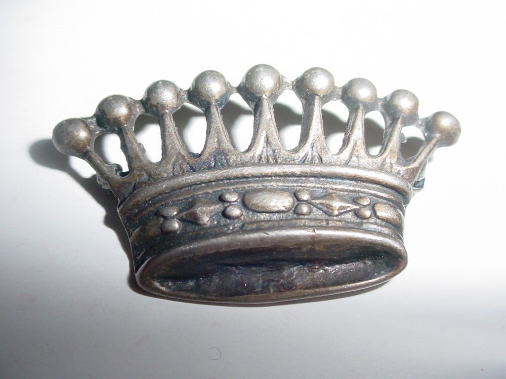 Vintage sterling crown brooch from the 1930s. Marked Sterling.  1 1/8 x 2 inches.