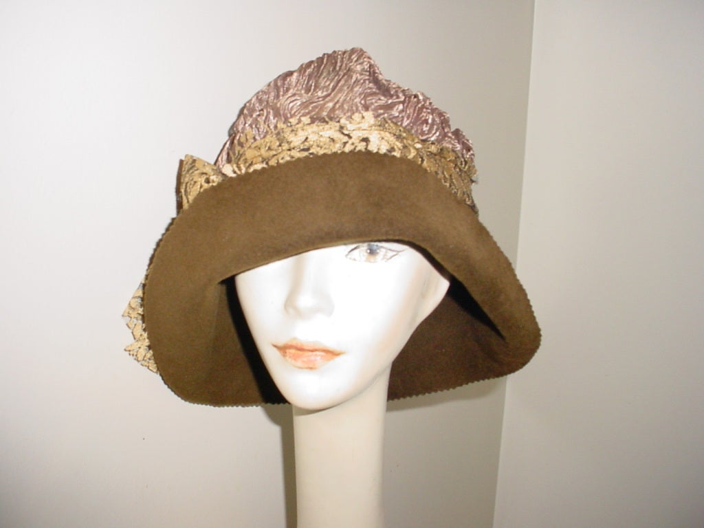 Lilliput brown felt hat with lace.  Lilliput is a traditional milliner using time-honoured techniques. Lilliput hats are in the collections of Celine Dion, Whoopi Goldberg, Rachel McAdams and Sandra Oh.