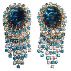 Vintage 1950s extravagant blue earrings with articulated rhinestone fringe