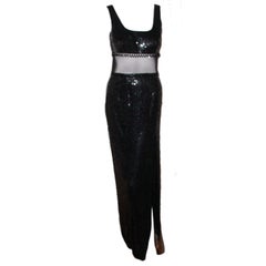 Long black sequin dress with sheer net inset and beads