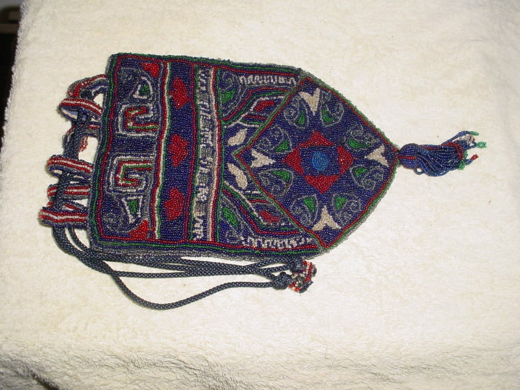 Beautiful Victorian beaded bag in vibrant colors. Excellent condition. Some very slight wear to lining. 5.5 x 8 inches excluding handles and beaded fringe at bottom