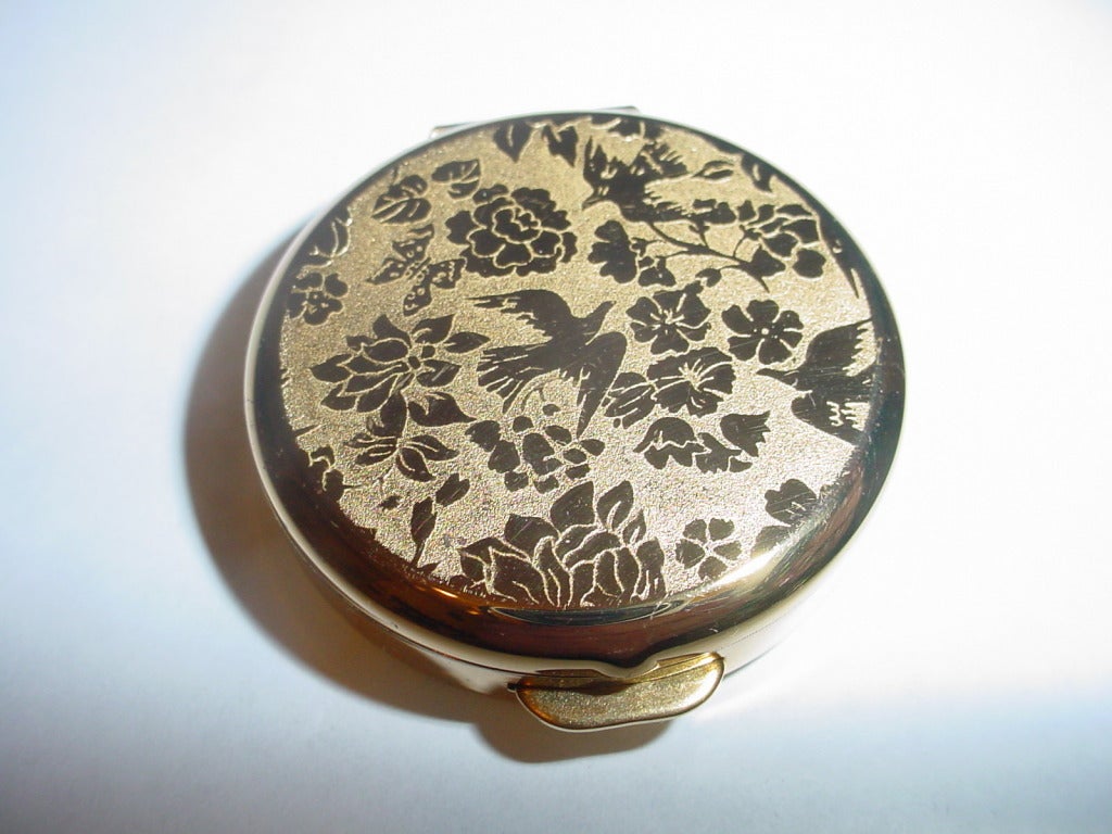 Vintage Nina Ricci L'air du temps solid perfume. Compact with mirror. Unused but solid perfume has melted a bit.