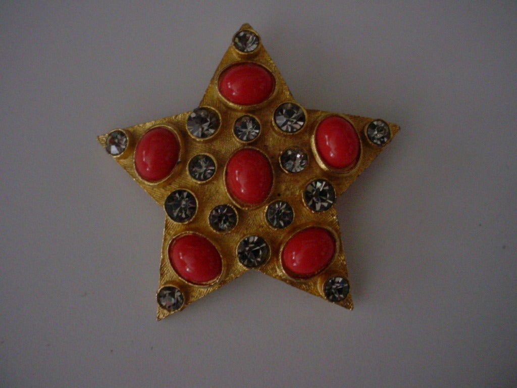 Star brooch with faux coral and rhinestones.2 1/4 in. x 2 1/4 in.