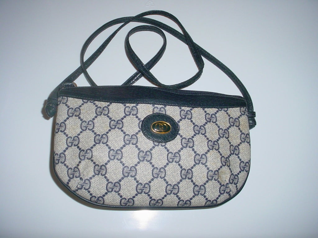 Vintage Gucci logo bag in navy. 9 x 6 inches. Drop on shoulder strap is 21 inches