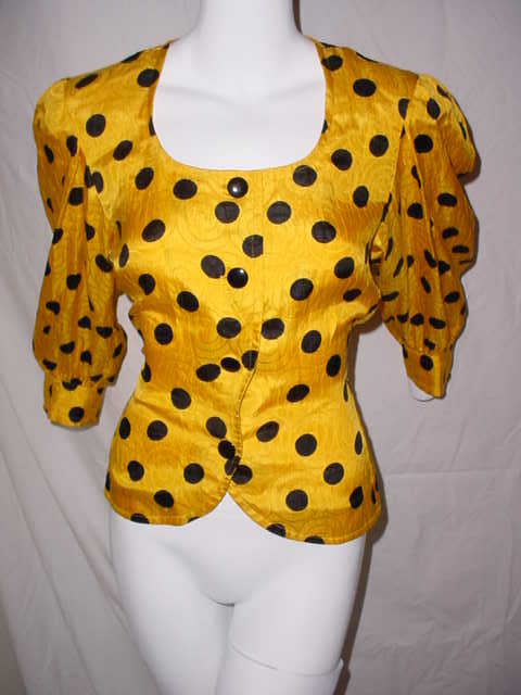 Vintage Yves Saint Laurent Variation 1980s silk blouse. Gold and black polka dots. Excellent condition.  38 inch bust, 32 inch waist, 23 inches long. Button front.