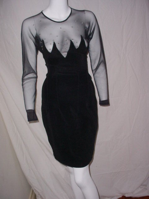 Vintage 80s dress by Tadashi. Black stretch with sheer net and rhinestones. Excellent condition. Size small.