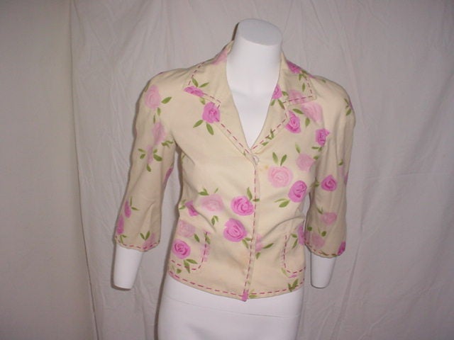 Vintage Moschino Cheap and Chic jacket. Nostalgic floral print in a cotton blend. Cream, pink and green. Pale pink lining. Italian size 40, US size 6.  34 inch bust, 19 inches long.