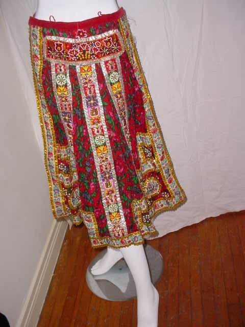 Vintage folklore costume from Hungary. Wool challis, velvet, beads. Very elaborate beadwork. Excellent overall condition. Some slight loss to beads. 30 inches long. One size fits most. Early 20th century.