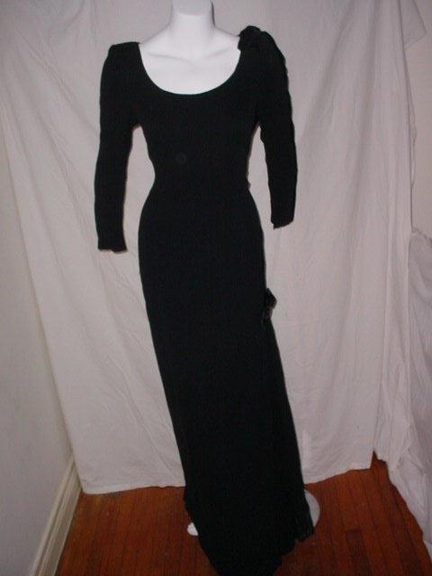 Vintage 90s dress by Escada Couture in silk. Euro size 38. 36 inch bust, 29 inch waist, 35 inch hips, 60 inches long. Excellent condition, some slight snags to one arm near the cuff. Beautiful scoop neckline with velvet bow on one shoulder and near