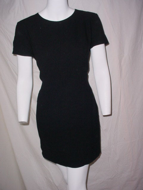 Beautiful wool crepe dress from Chanel. Labeled size 40. 36 inch bust, 32 waist, 38 hips, 33 inches long. Back zipper. Excellent condition. Classic, timeless style.