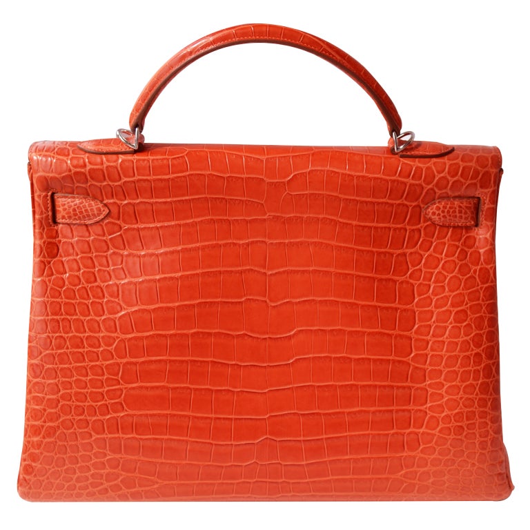 Createurs de Luxe is excited to bring you this brand new crocodile Hermes Kelly Handbag!

40cm Hermes Matte Sanguine Porosus Crocodile Kelly Handbag | Palladium Hardware | P Stamp

The bag measures 40cm / 15.75