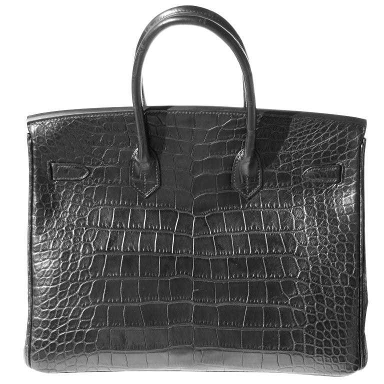 DROP DEAD GORGEOUS!!

BRAND NEW

35cm Hermès Matte Black Alligator Birkin Handbag | Diamonds | White Gold Hardware | P Stamp

The bag measures 35cm / 14