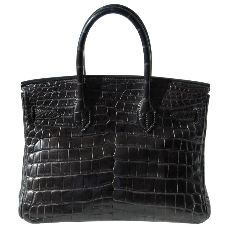 Pre-owned

30cm Hermes Matte Anthracite Niloticus Crocodile Birkin Handbag | Brushed Palladium | F Stamp

This handbag is in fabulous condition. Gorgeous color!

The bag measures 30cm / 12