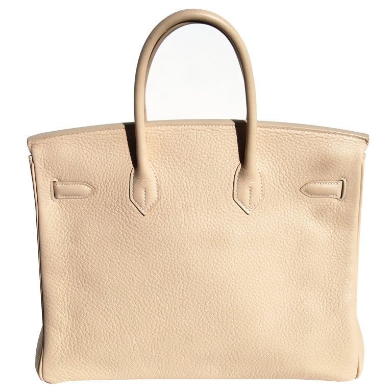 Brand New!

The Perfect Handbag!

35cm Hermes Beige Taurillon Clemence Leather Birkin Handbag with White Stitching | Palladium Hardware | M Stamp

We're not sure on the color's name! Beige shade!

The bag measures 35cm / 14