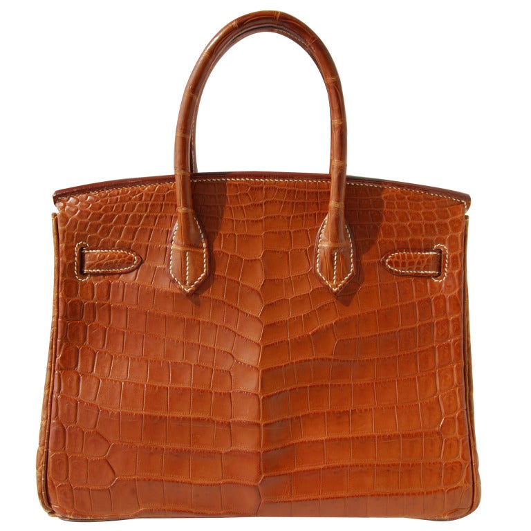 FABULOUS COLOR!

Pre-owned

30cm Hermès Matte Fauve Niloticus Crocodile Birkin Handbag | White Stitching | Gold Hardware | E Stamp

The bag measures 30cm / 12