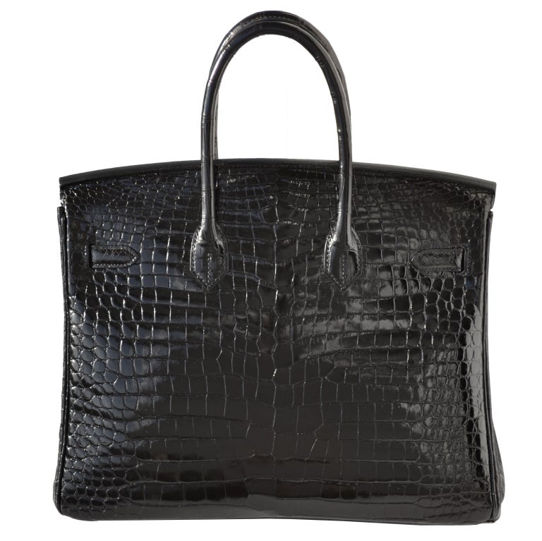 Creatéurs de Luxe, reseller of Hermès Handbags offers this absolutely amazing pre-owned 35cm Hermès Shiny Black Porosus Crocodile Birkin Handbag with Diamonds!!

Original Hermès Diamond Birkin Bag!

Pre-Owned - Like Brand New

35cm Hermès