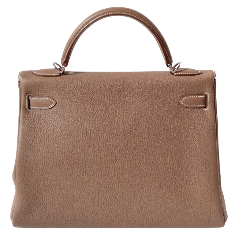 The Perfect Handbag!
Creatéurs de Luxe offers this brand new Hermès Birkin Handbag.
Brand New!

32cm Hermès Etoupe Togo Leather Kelly Handbag with White Stitching | Palladium | O Stamp

The bag measures 32cm / 13