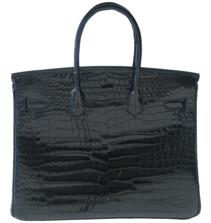 Brand New

Creatéurs de Luxe offers this brand new Hermès Birkin Handbag.

35cm Hermès Shiny Black Porosus Crocodile Birkin Handbag | Palladium Hardware | N Stamp

The bag measures 35cm / 14