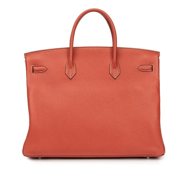 Birkin Sanguine

Pre-owned Birkin as new! Used very few times...no marks, no scratches, no wear at all.

The date-stamp has letter O (2011).
The Hermès-Paris stamp is embossed in silver.

The bag comes as a full set:
bag, sleeper and