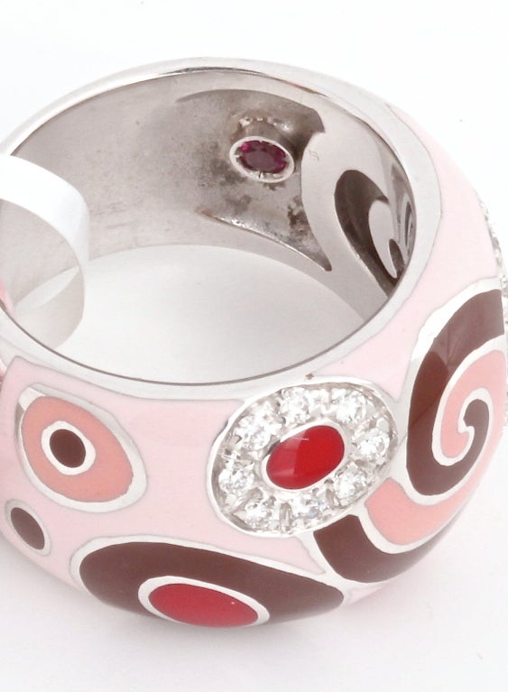 This is a fun, chic ring from Roberto Coin. It has 23 pave diamonds and a swirling, bubbly design of white gold and enamel, plus the hidden Roberto Coin signature ruby. This is a very happy ring. It retails for $3,860.00

RING SIZE: 6.5

METAL:
