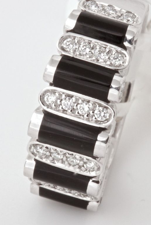 This amazingly designed ring by Asprey has a matching necklace that we also have for sale on eBay. This BRAND NEW, with tags ring from Asprey retails for $7,100 dollars. This one is a size 6. Five bars of onyx and five bars of pave diamonds