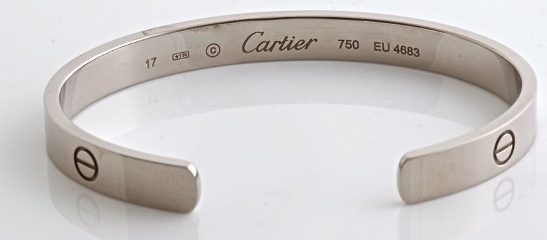 This is a beautiful cuff bracelet from Cartier. It is size 17. It is in excellent condition. And it weighs 26.8 grams of solid 18k white gold. GORGEOUS!