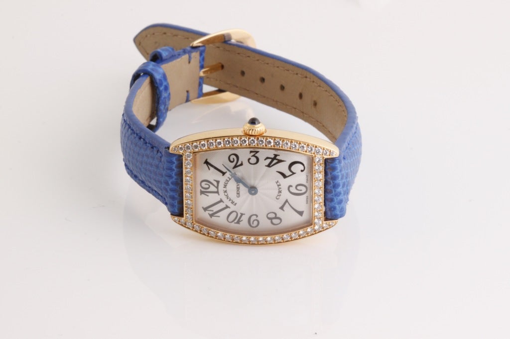 This is the limited edition Franck Muller Cintree Curvex. (This one is number 47.) It has a magnificently shaped case that presents sweeping curves on nearly every surface. The case is surrounded by beautiful white diamonds set into yellow gold.