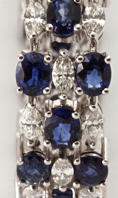 Absolutely beautiful! This is a spectacular three row bracelet with exceptional natural and un-enhanced blue sapphires and white diamonds. it is simple yet elegant and with over 12 carats of blue sapphires and almost 4 carats of white diamonds it is