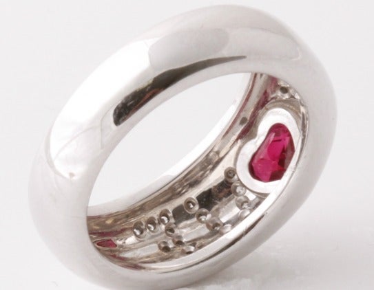 This ring features a .94 carat gorgeous ruby as the 