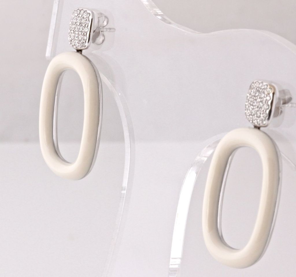 Classically modern and super beautiful. These earrings from Tiffany & Co. are phenomenal. The design is reminiscent of the 60's but they are completely contemporary and in absolutely Excellent condition. The coral, rounded rectangles are a beautiful