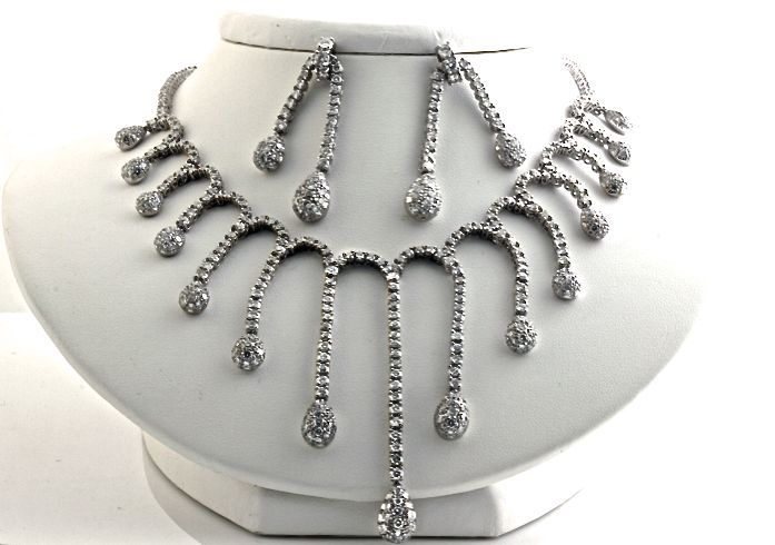 This necklace and earring set is absolutely bonkers. The earrings and the necklace are completely covered in white diamonds. The design is fun and dramatic. This is what you will wear to your high school reunion. Twenty four and a half carats of