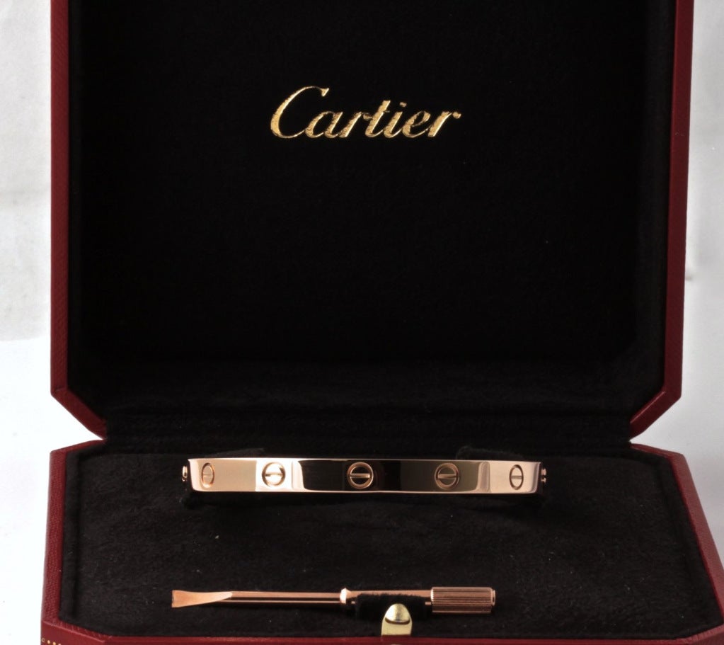 We found another fantastic LOVE bracelet from Cartier. This one is a size 18 and it's ROSE gold and it is in EXCELLENT condition. It will come with the box and the screwdriver you see in the photos. These are getting harder and harder for us to