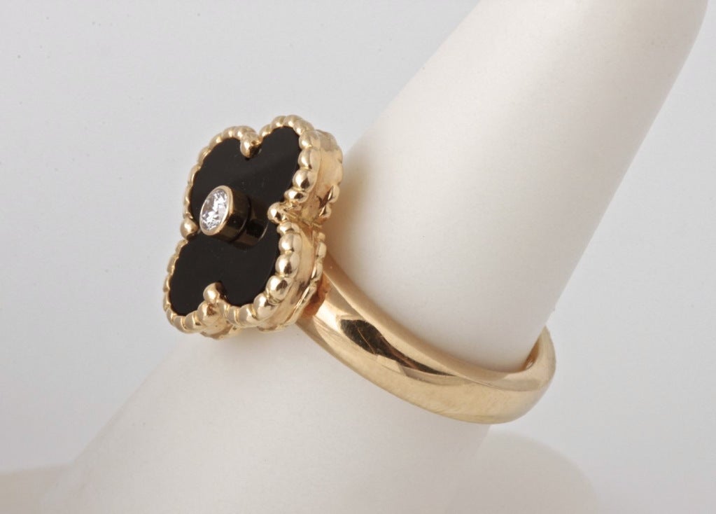 This is a great ring from Van Cleef & Arpels's vintage Alhambra collection. It's simple, but there's a lot of design in this little ring. The beaded gold around the flower in particular is a really nice touch.

RING SIZE: 5 3/4 (It can be