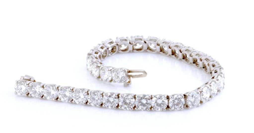 This amazing tennis bracelet has 22 carats of F-H in color White Diamonds with a clarity rating of VS-1 to VVS-2. They are round brilliant cut and they are absolutely stunning. The bracelet measures 7 inches long and it weighs 27.5 grams.

This