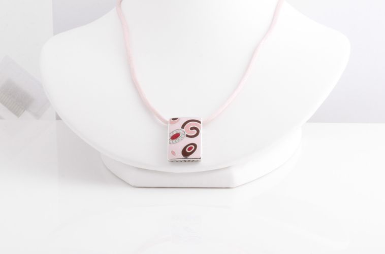 Here is another fantabulous necklace from Roberto Coin and the enamel collection. This one is rectangular with swirls of pinks and red enamel with gorgeous pave diamonds. On the back it is stamped 