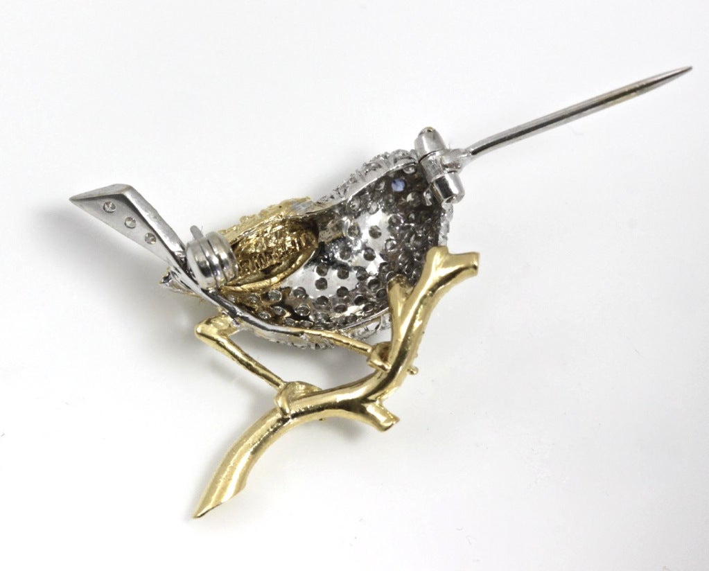This is a darling little bird resting on a branch. It's very cute and sunny, covered with a lot of diamonds, but still retaining a certain innocent charm.

WEIGHT: 3.9 grams

NUMBER OF DIAMONDS: Approx 67

DIAMOND WEIGHT: approx. .60