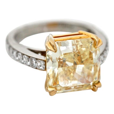 6.94 Fancy Yellow Diamond  
White Diamond Platinum Ring Size 6