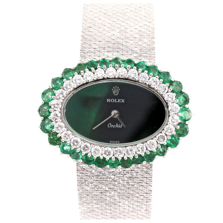 Rolex Lady's White Gold, Diamond and Emerald Bracelet Watch