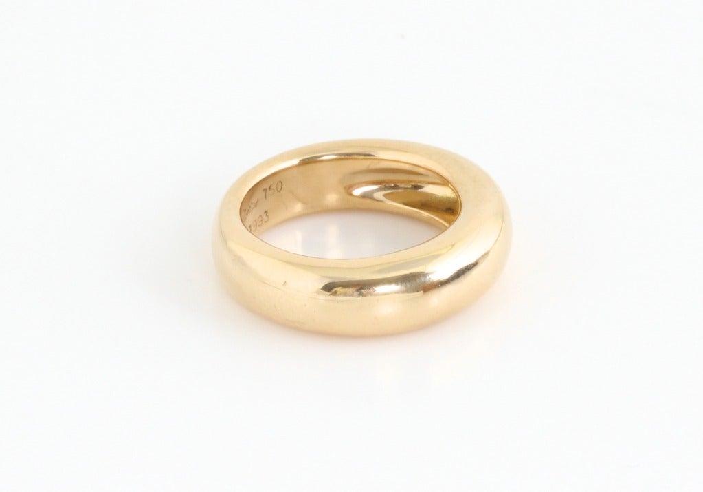 This is what Cartier does so well. They take a simple, classic design, give it a few subtle tweaks, and the result is both timeless and modern. This is a chunky gold ring that is ever so slightly wider on one side than the other. A
