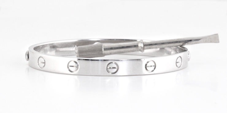 What else can I say about Cartier's love bracelets? This one is white gold with a box and a screwdriver. It's a size 17 and it's great. It's from 1993, and it has the screws that come all the way out.

 

WEIGHT: 33.6

 

SIZE: 17