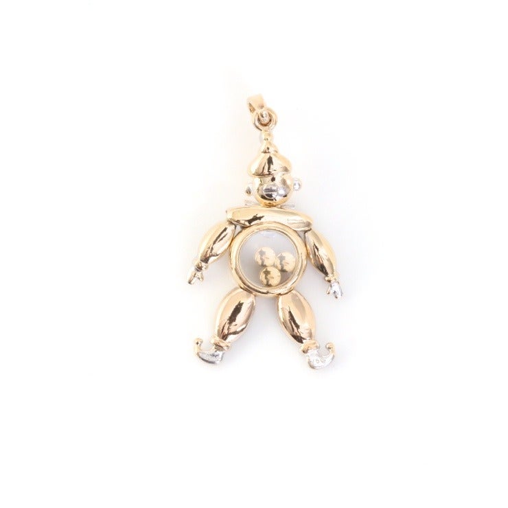 This is a quirky, fun pendant or charm from Chopard. The floating diamonds are called 