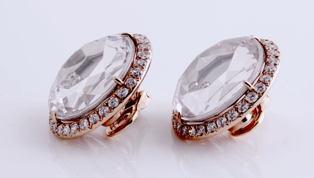 Visit MatterLA.com for more jewelry and accessories.

Diamonds encircle the glass case holding five freely-moving diamonds. The back wall of each glass showcase is mirrored. The gold is 18k rose gold.

These are really impressive earrings that