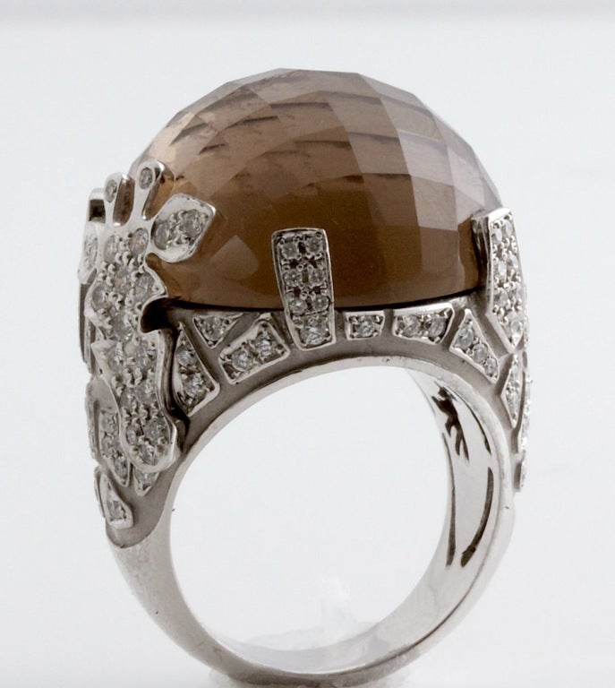 Best. Ring. Ever. It's mysterious and edgy, yet still playful and young. The huge faceted smokey quartz semi-sphere is just stunning. It's surrounded by white gold and diamonds. And giraffes!

This line is hot right now and this ring is BRAND NEW,