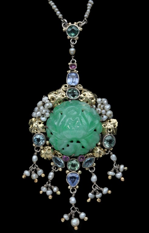 An opulent Arts & Crafts pendant necklace incorporating a carved jade rose. Exquisitely made with a strong byzantine influence