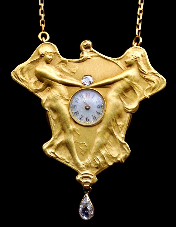 Delightful Pendant Watch.
Inspirations: Nicolas Poussin - 'A Dance to the Music of Time' & 'Dance of the Hours' by Flaxman the great Georgian sculptor who designed the Wedgwood friezes. 
Delicately modelled bass relief in the manner of Rene